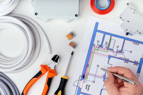 electrician-checking-electrical-plans-concept-repair-equipment-177877302-1